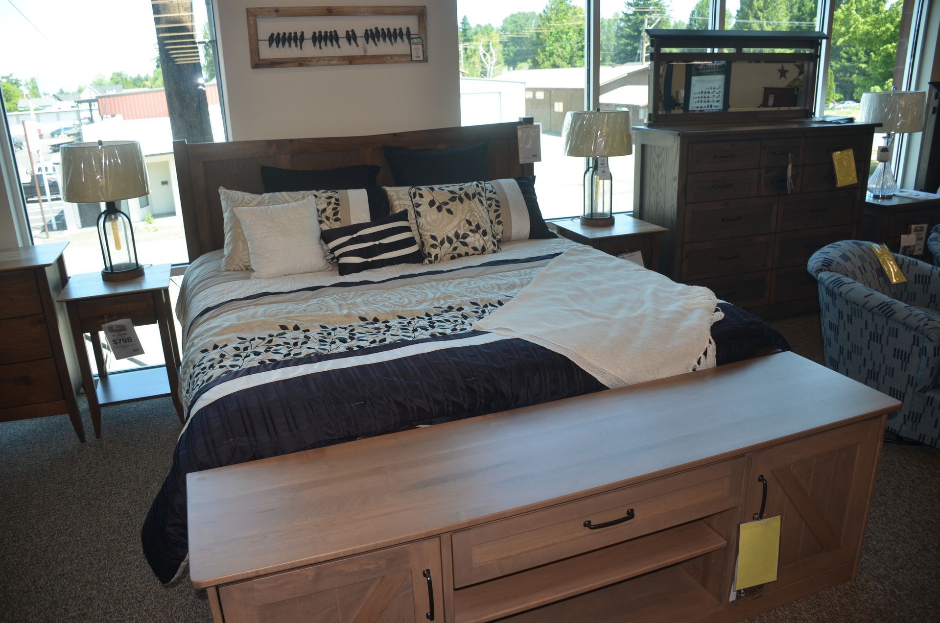 A bedroom with a bed and a bench in it