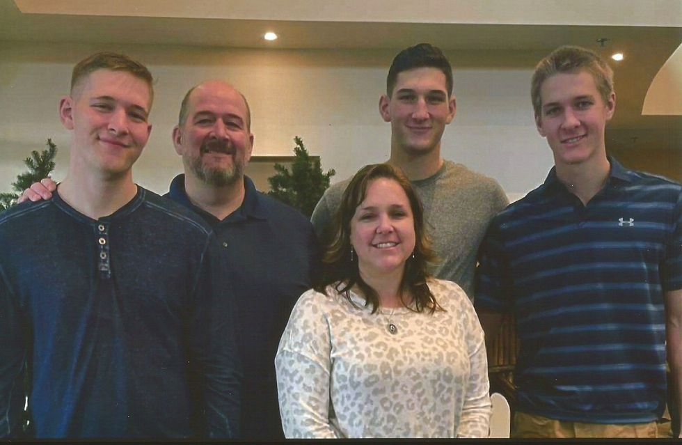A group of people are posing for a picture together.