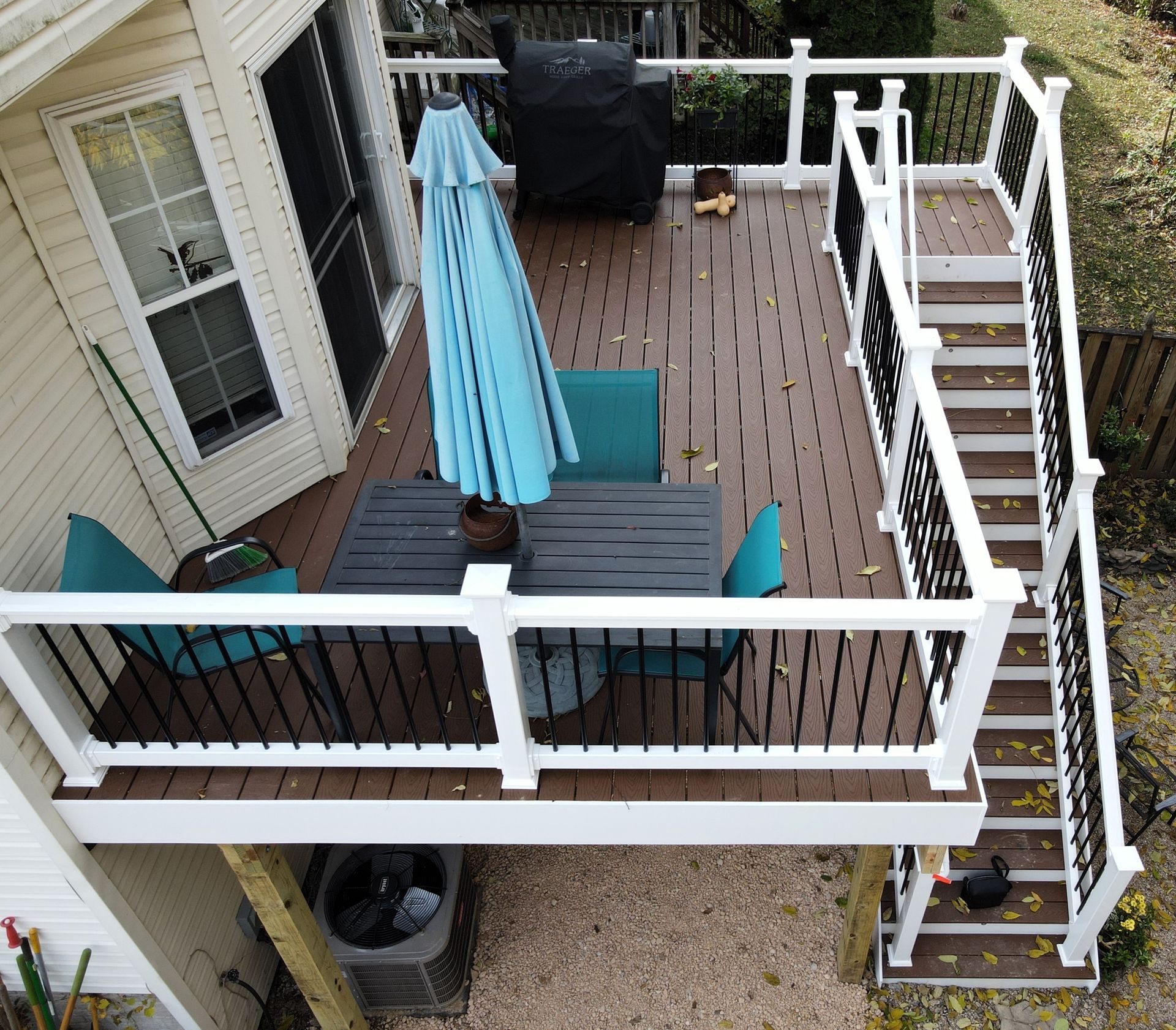 trex decks with blue patio umbrella