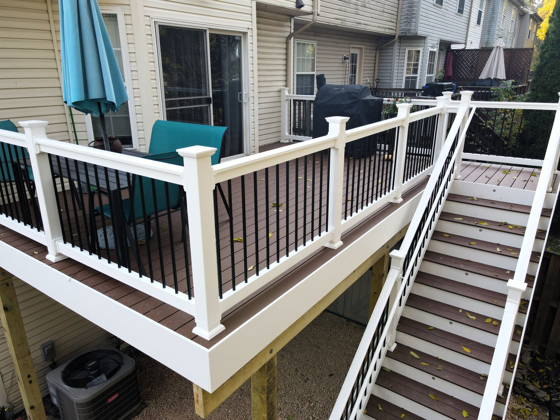 beautiful white deck with blue chairs