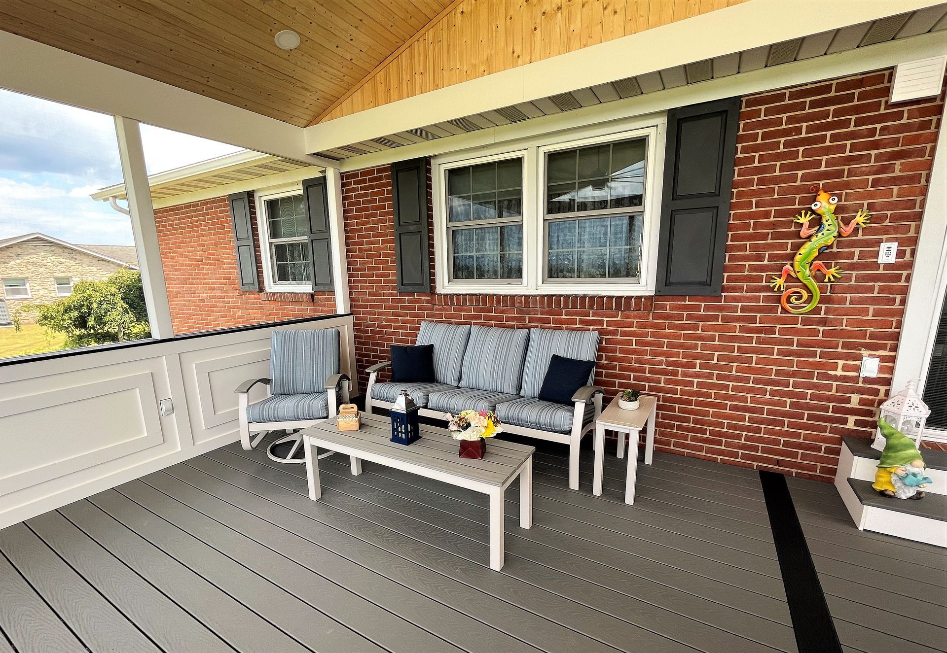 Screen porch view with wooden roof side view