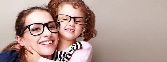 Mother and daughter wearing eyeglasses
