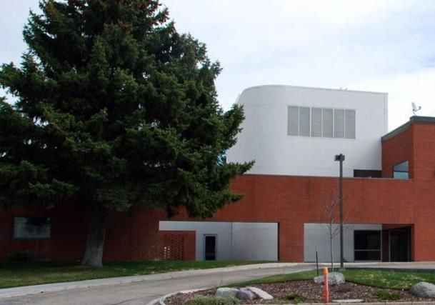 A large building with a tree in front of it