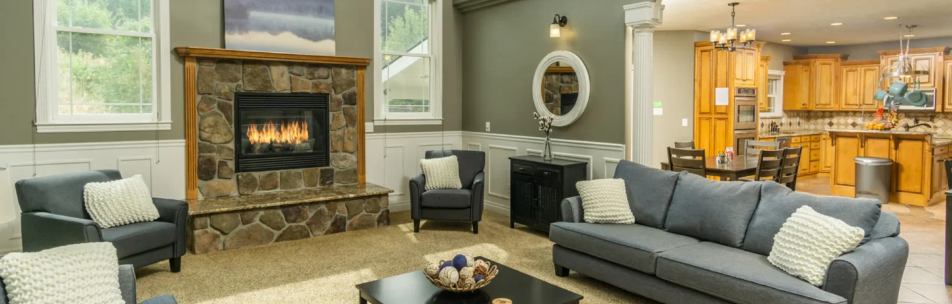 A living room filled with furniture and a fireplace