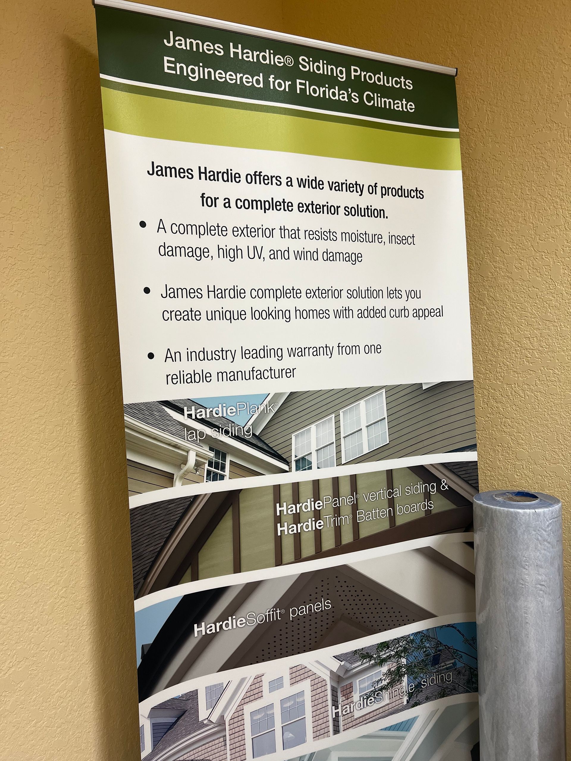 University poster on engineering, with green header and photos of a building and bridge on a stand.