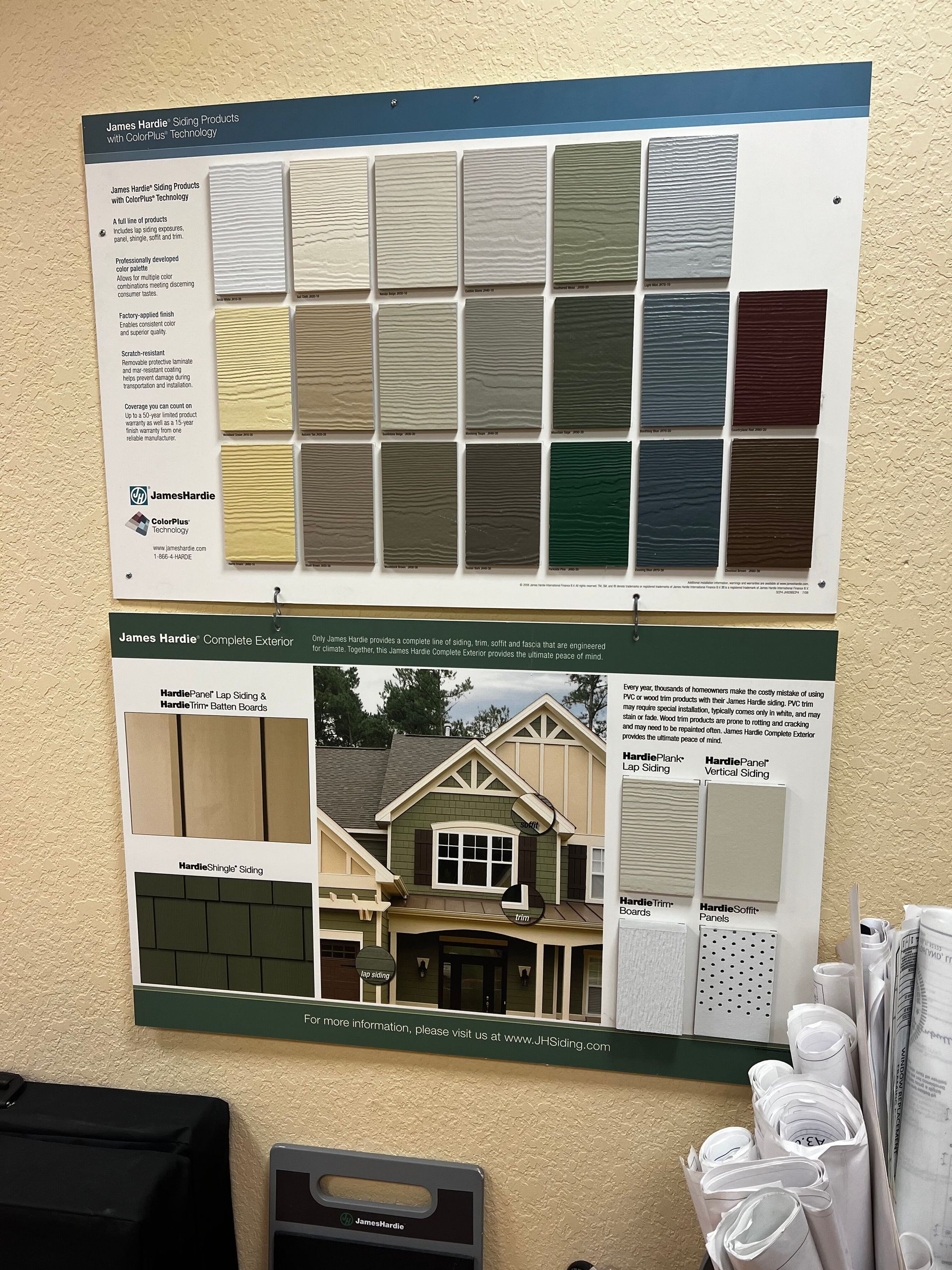 Color swatch boards and a house rendering displaying exterior siding and trim color options