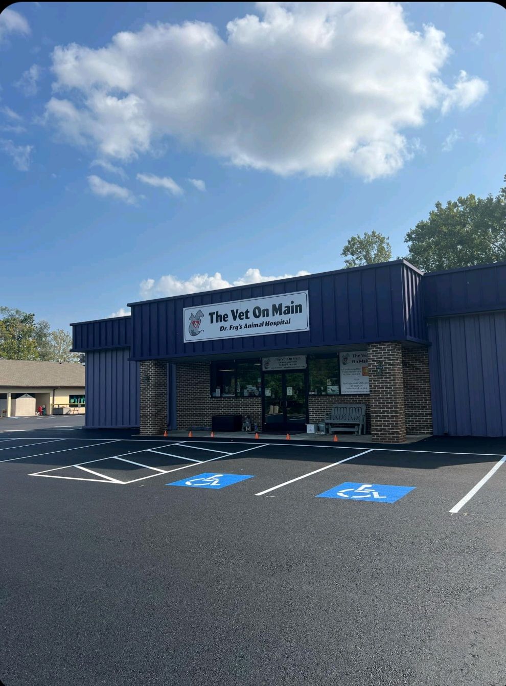 A building with a handicapped parking spot in front of it