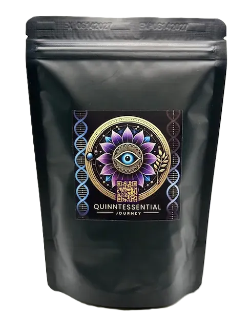 A black, sealed pouch featuring a label with an eye and flower icon, and the text QUINNTESSENTIAL JOURNEY.