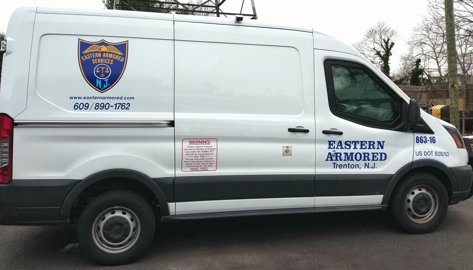 A white van with eastern armored written on the side