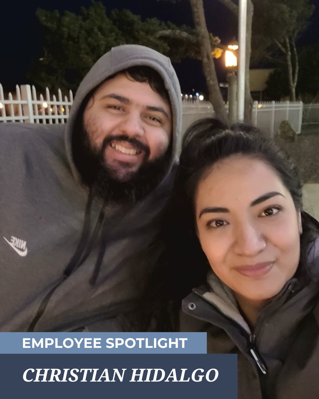 Two smiling people outdoors at night, with text reading “Employee Spotlight: Christian Hidalgo.”