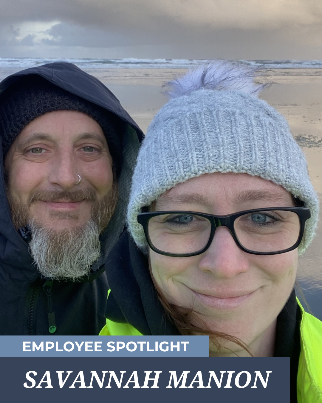 A man and a woman are standing next to each other on a beach.