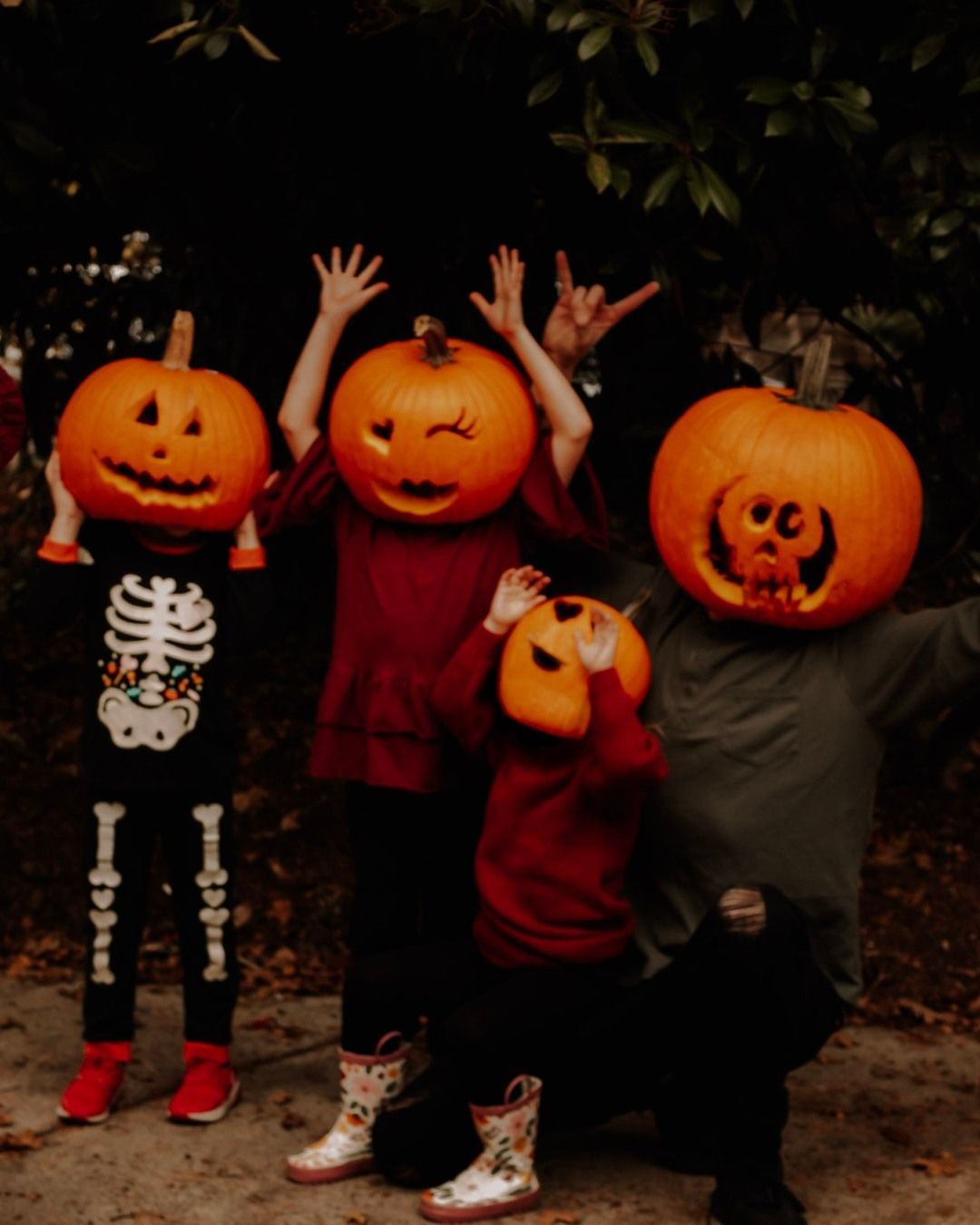 Four children in pumpkin heads