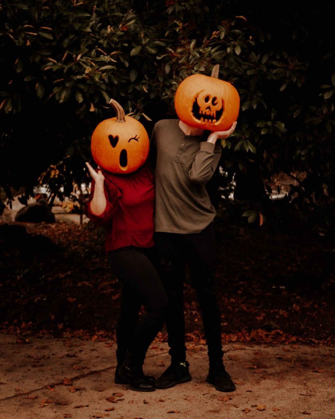Two people with pumpkin heads