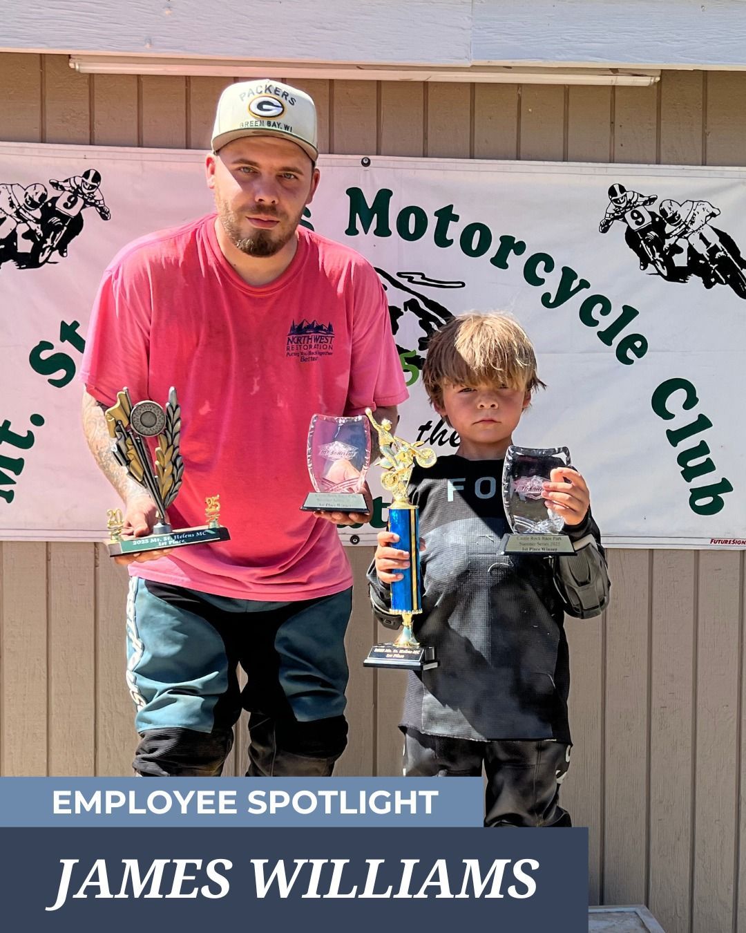 Man and boy holding trophies 