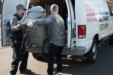 Worker loading equipment in service van
