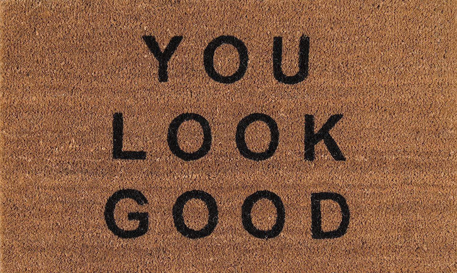 Brown doormat with black text: 