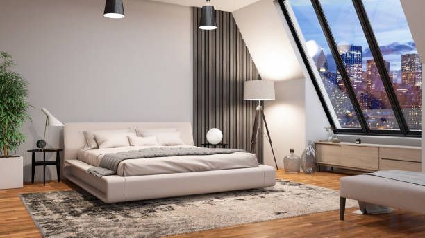 Modern bedroom with bed, city view window, and rug.