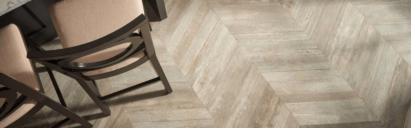 Herringbone wood floor and chair legs.