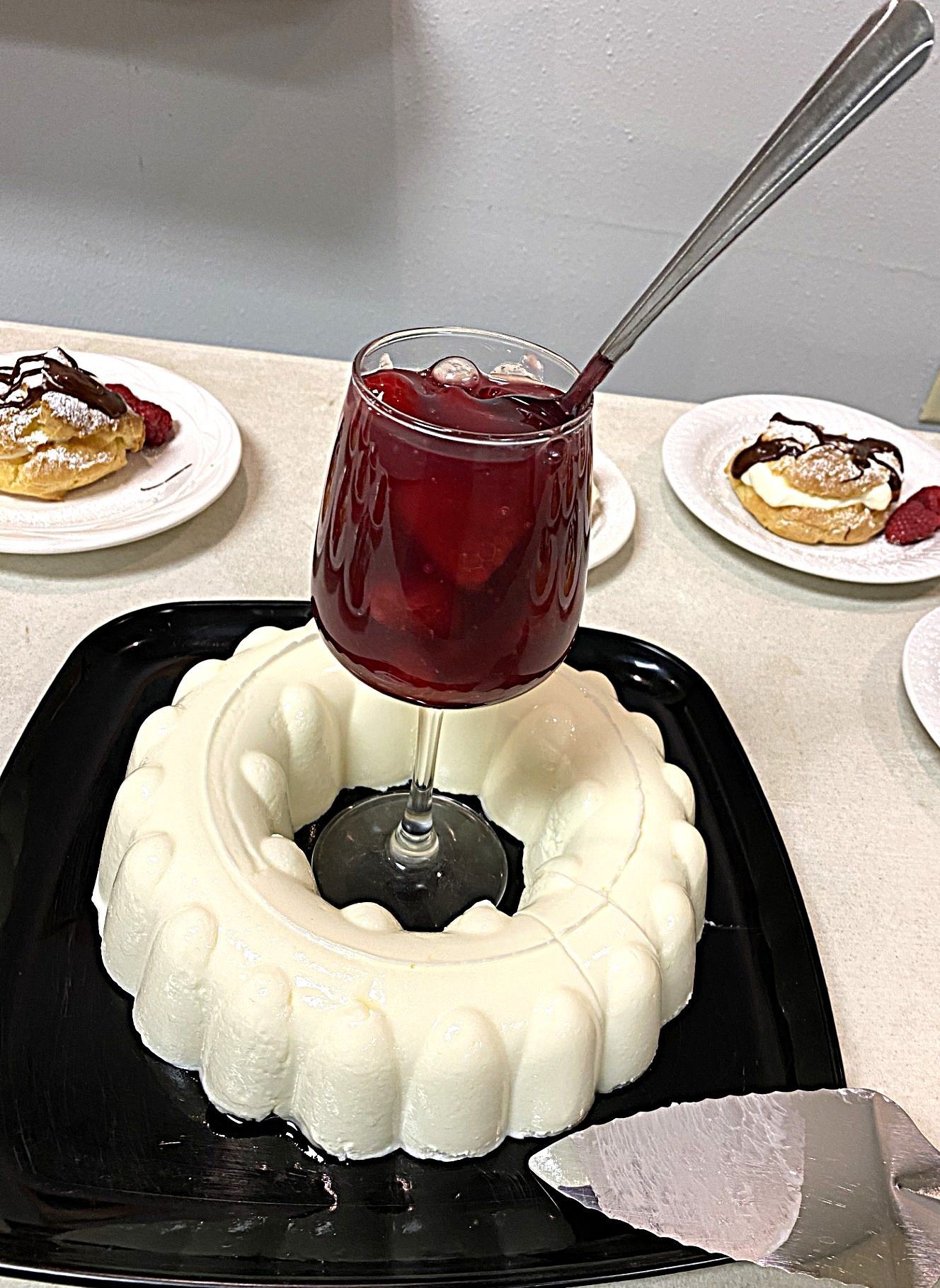 Buffet table with decorative platters of sliced meats, cheese, and appetizers at an event