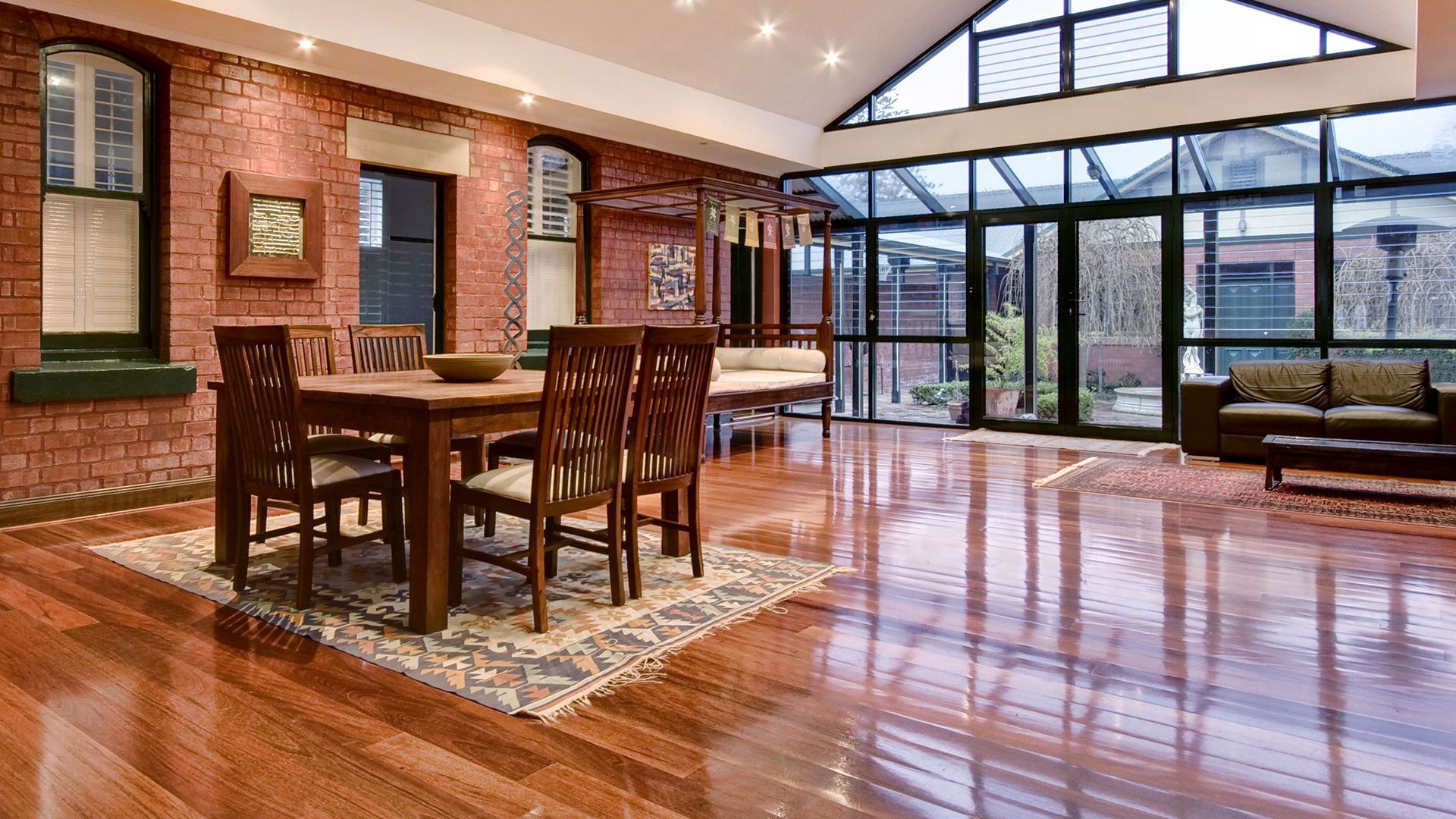A large room with a table and chairs in it