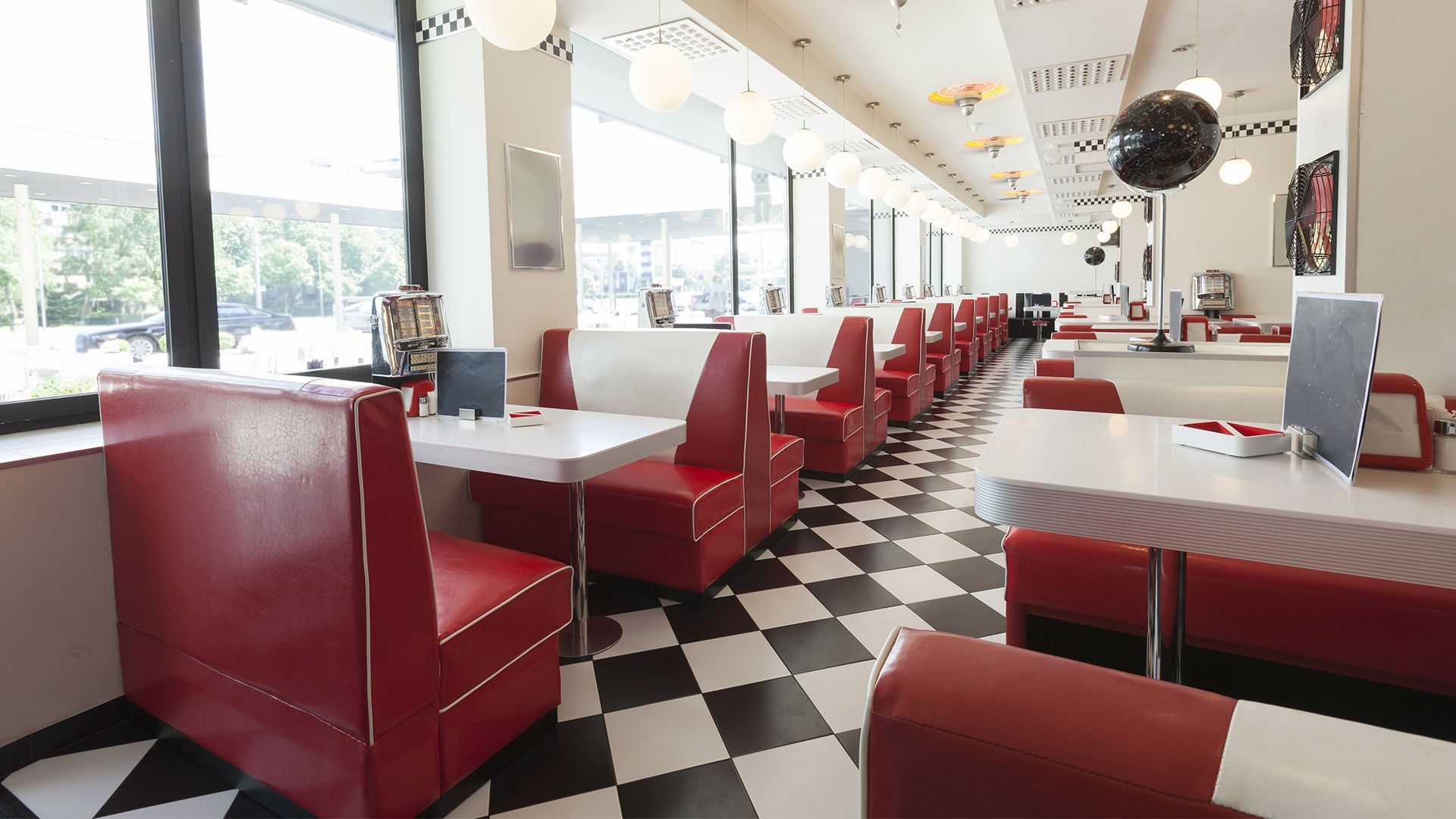 A diner with red and white booths and tables