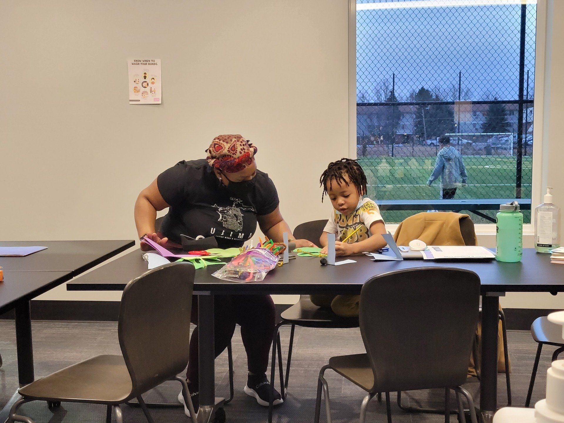 Woman teaching a kid