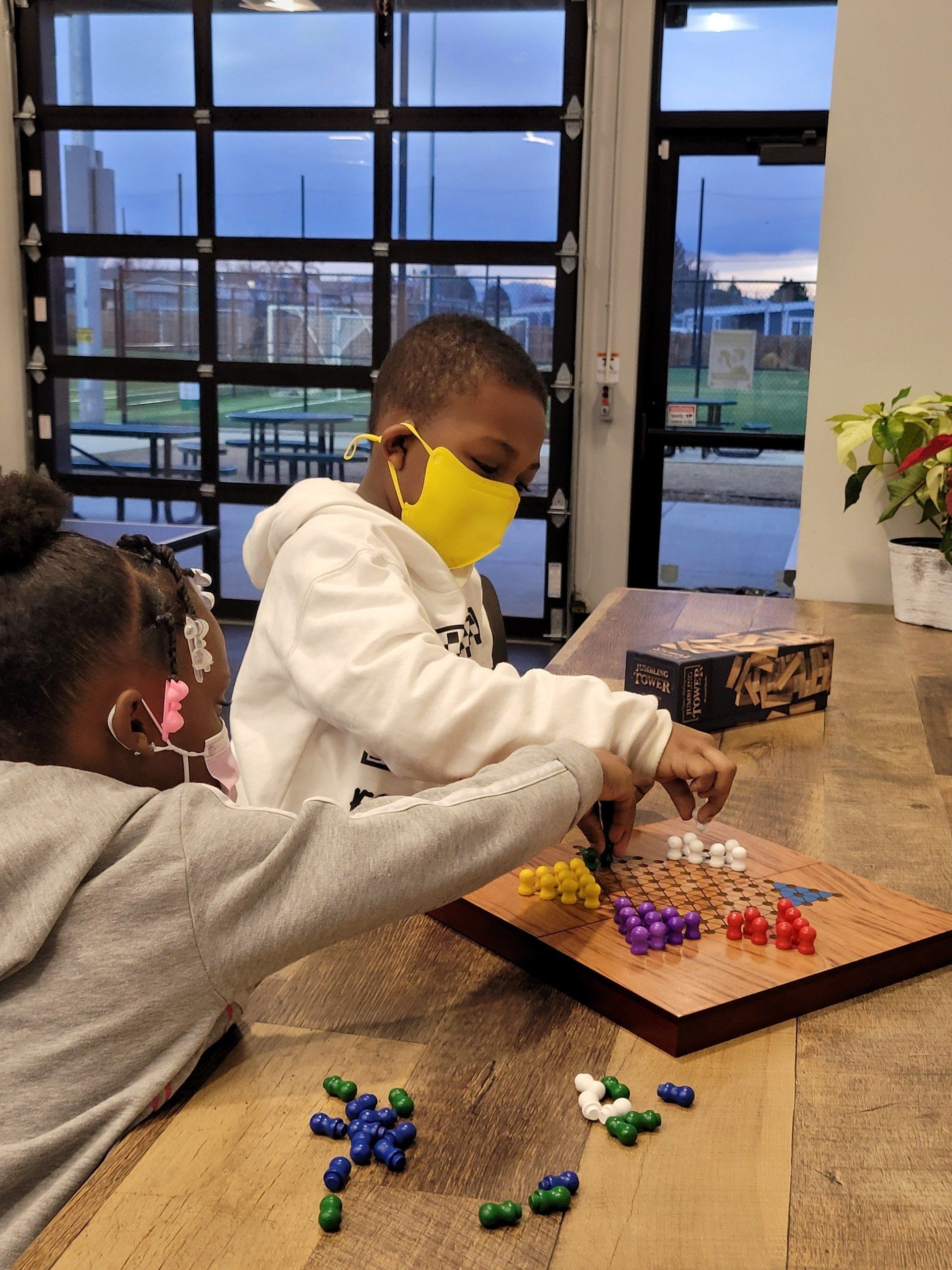 Kids playing board game