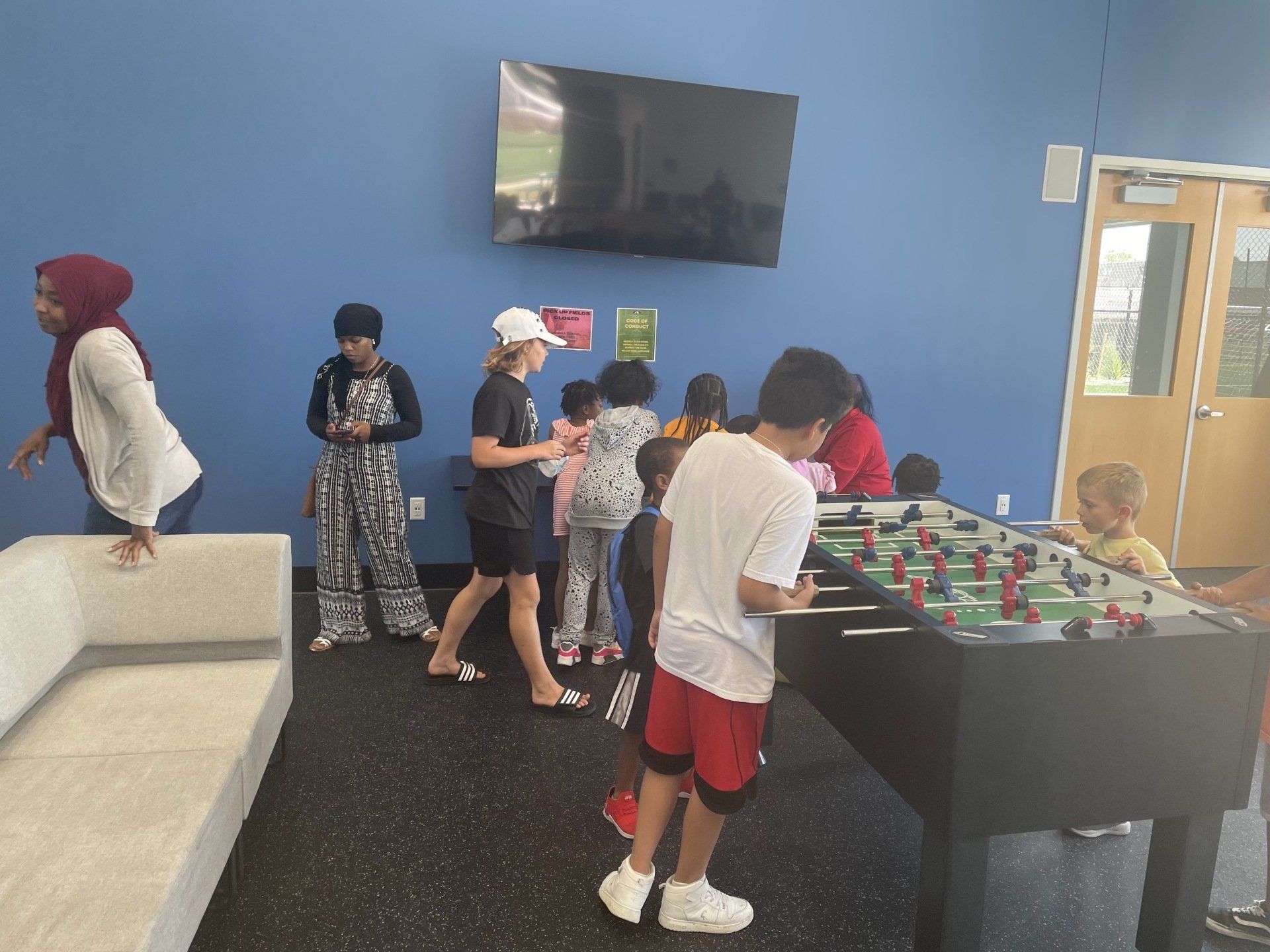Boy playing tabletop football
