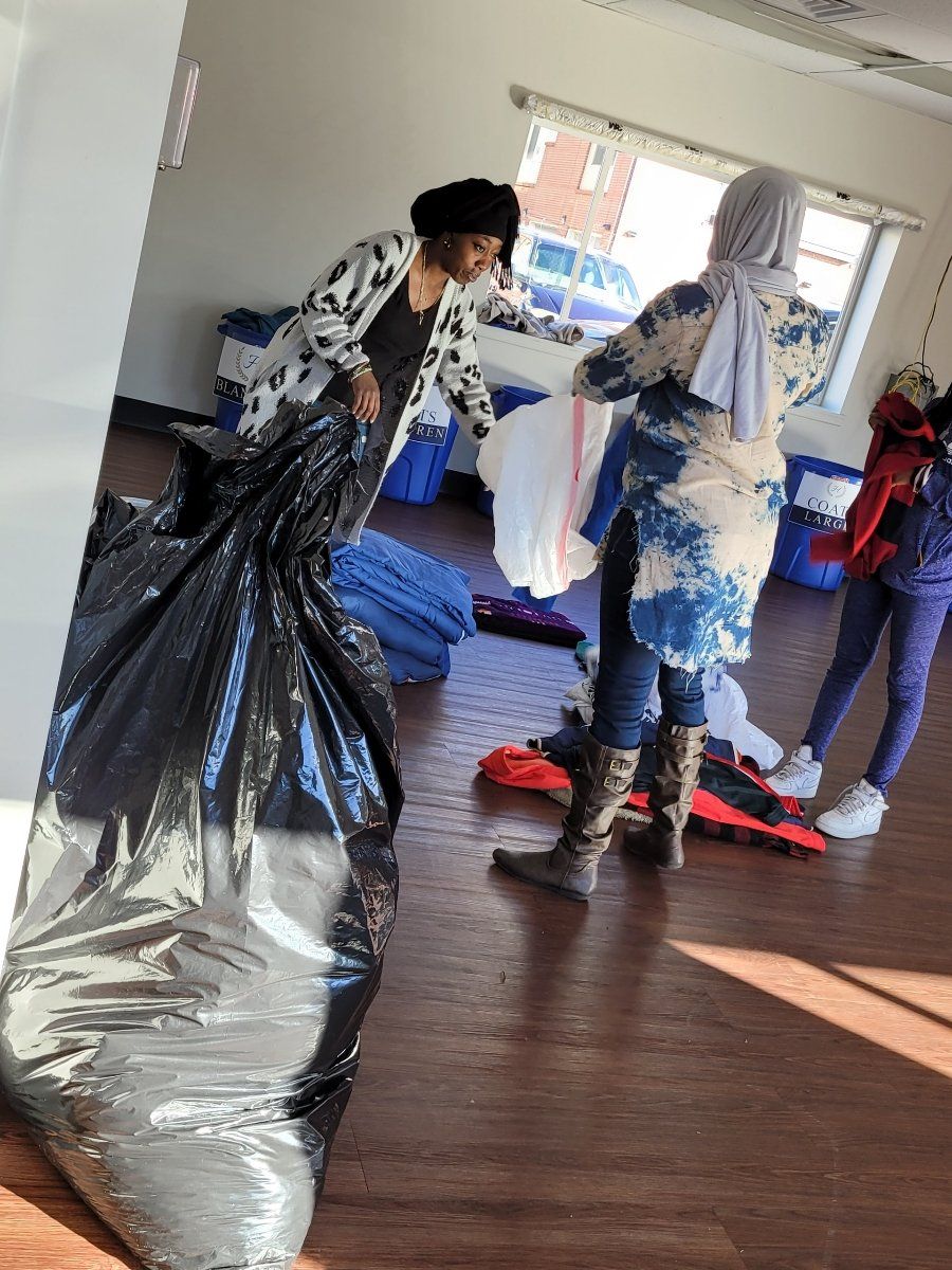 Woman holding a trash bag