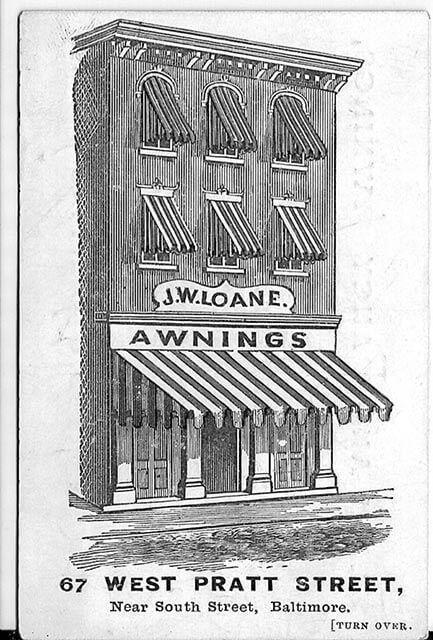 A black and white drawing of a building with awnings on it