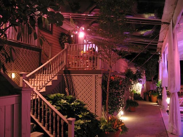 A staircase leading up to a balcony at night