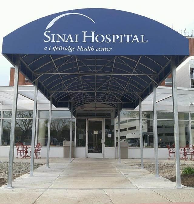 A blue canopy over the entrance to sinai hospital
