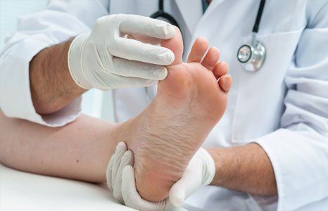 Doctor examines athlete's foot