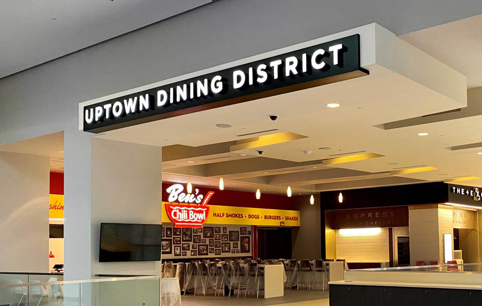 A restaurant called uptown dining district is located in a mall