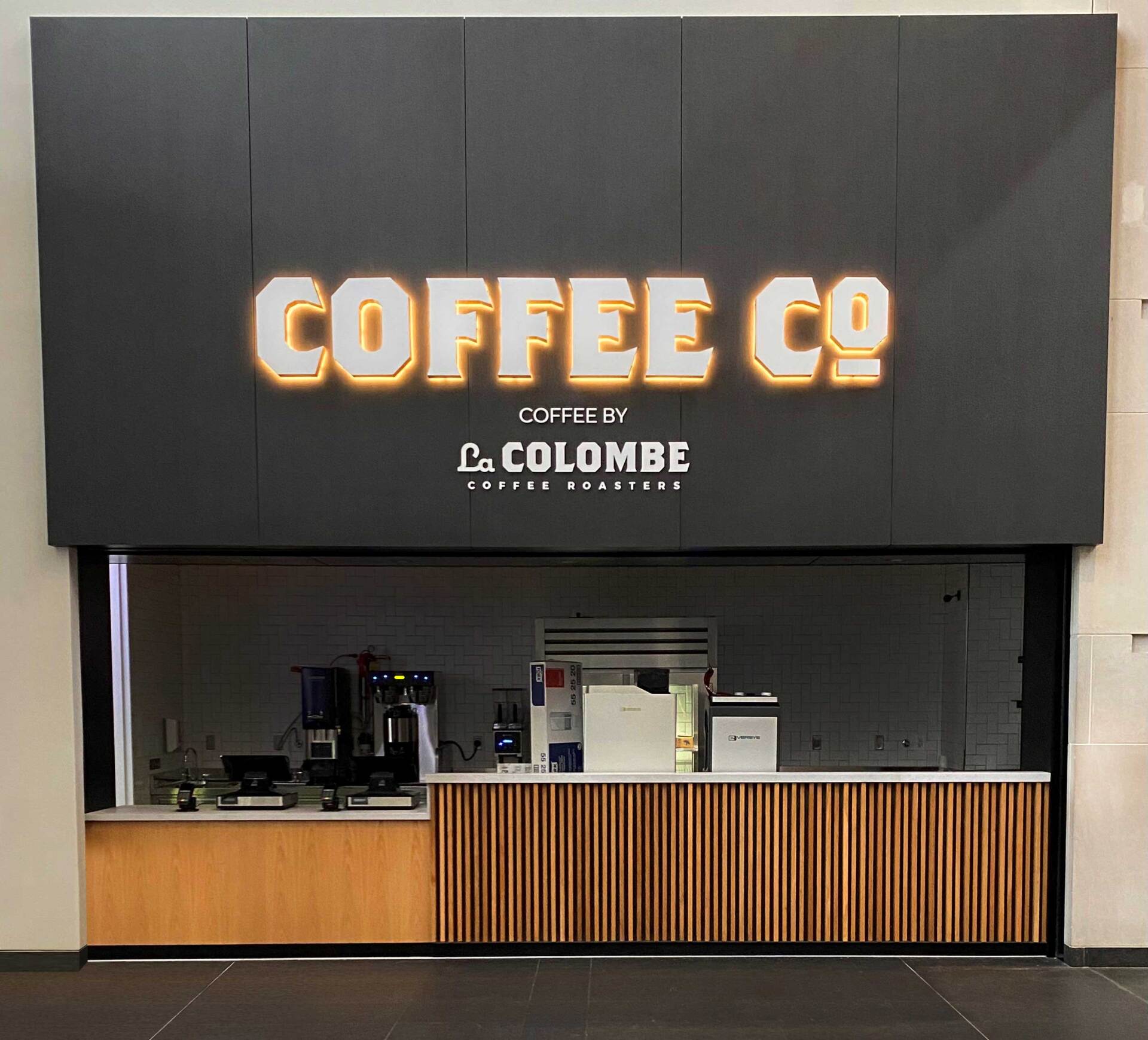 A coffee shop with a large sign that says coffee co