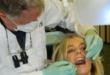 Dr. Guess working on woman's teeth