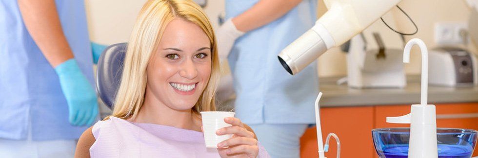Woman smiling on dental chair