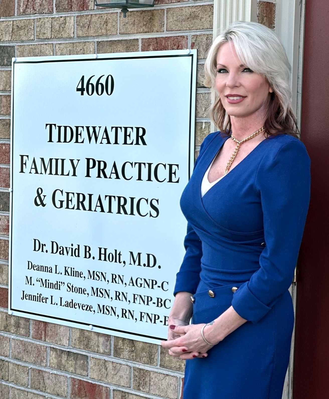 Deanna Kline standing outside next to Tidewater Family Practice sign