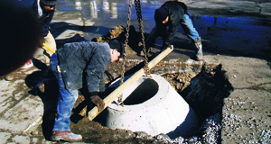 Men working on sewer system
