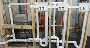 Plumber working on pipe