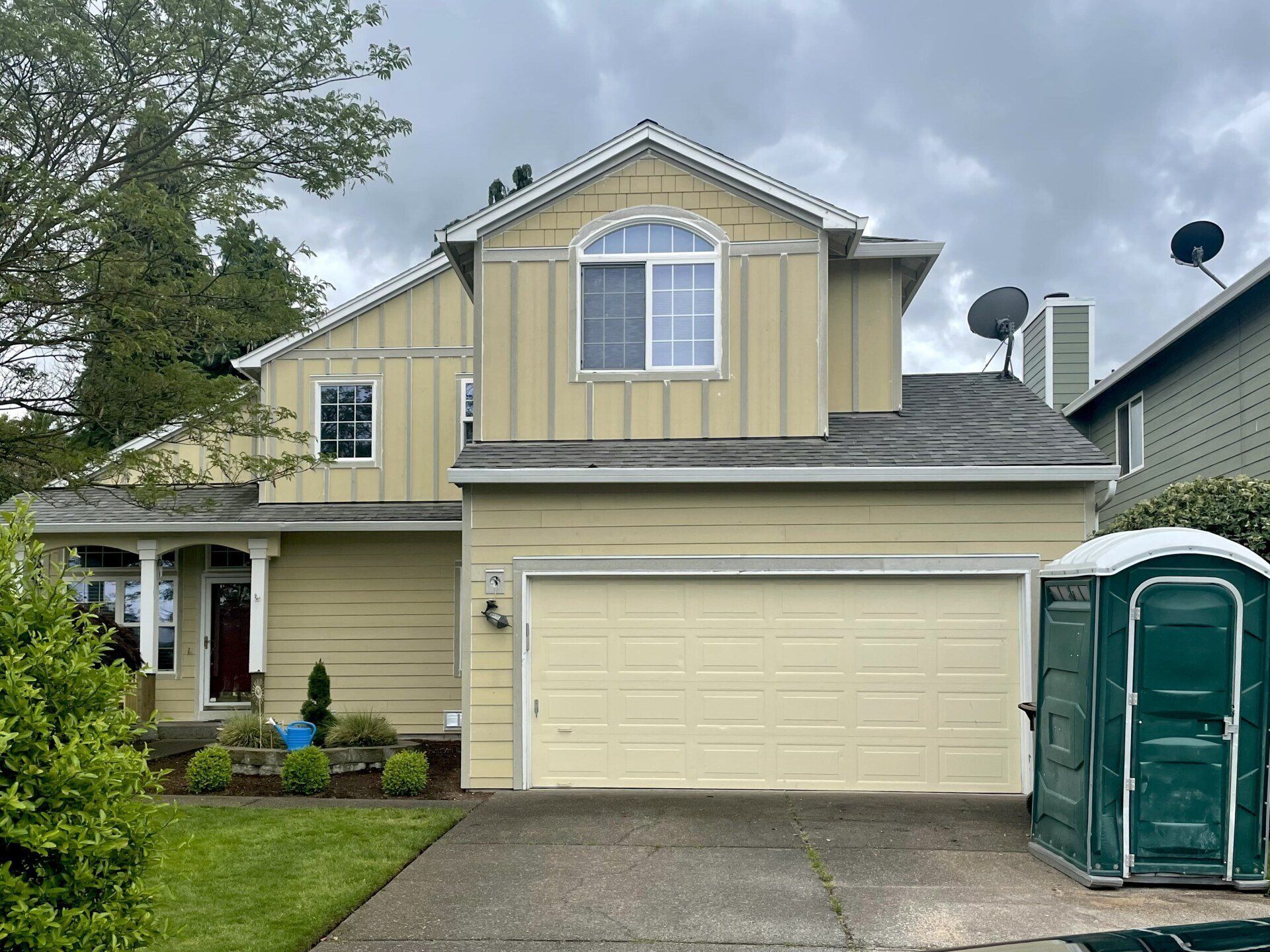 cream house with portable toilet