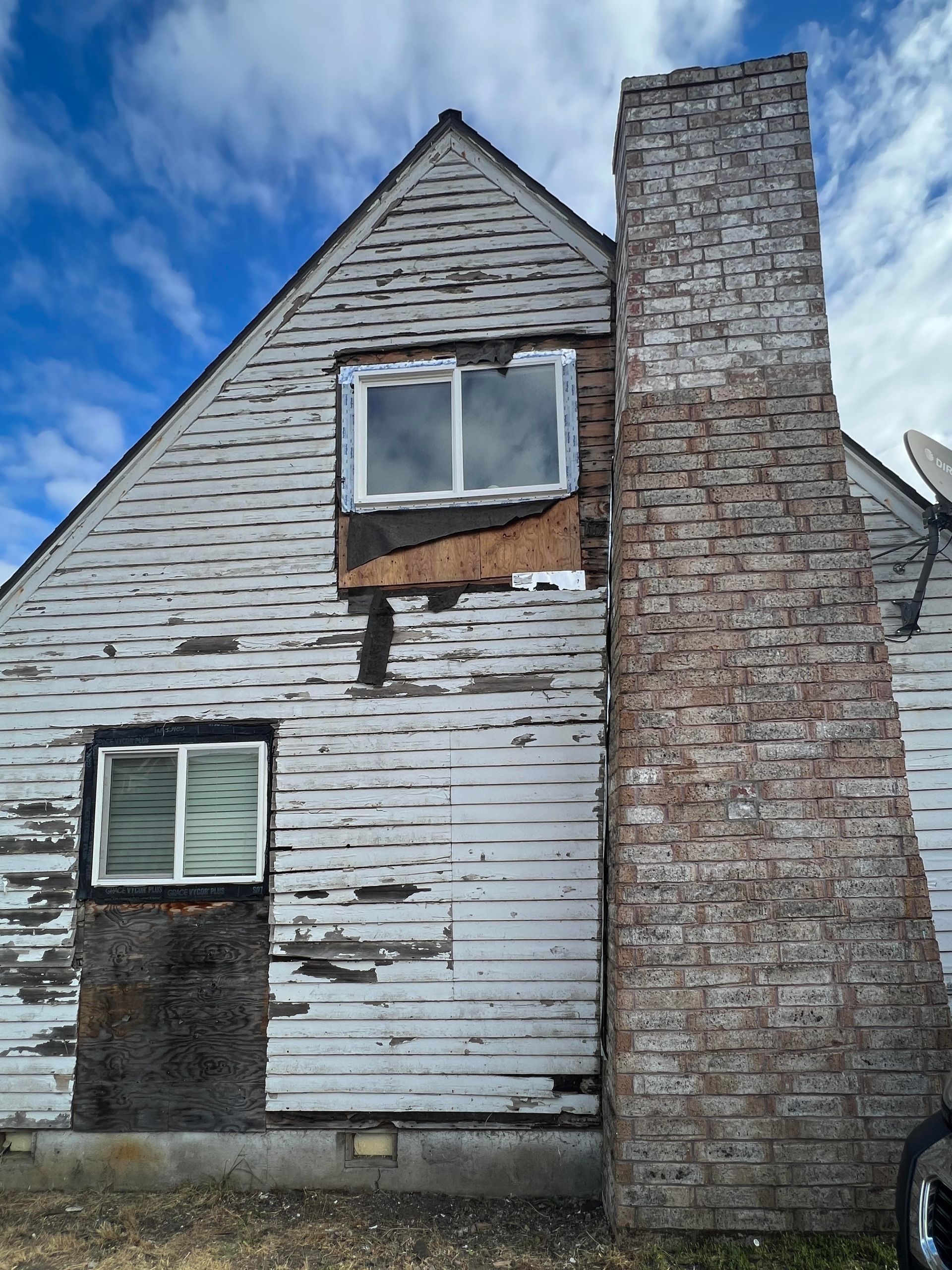 Siding project for a property with chimney before photo