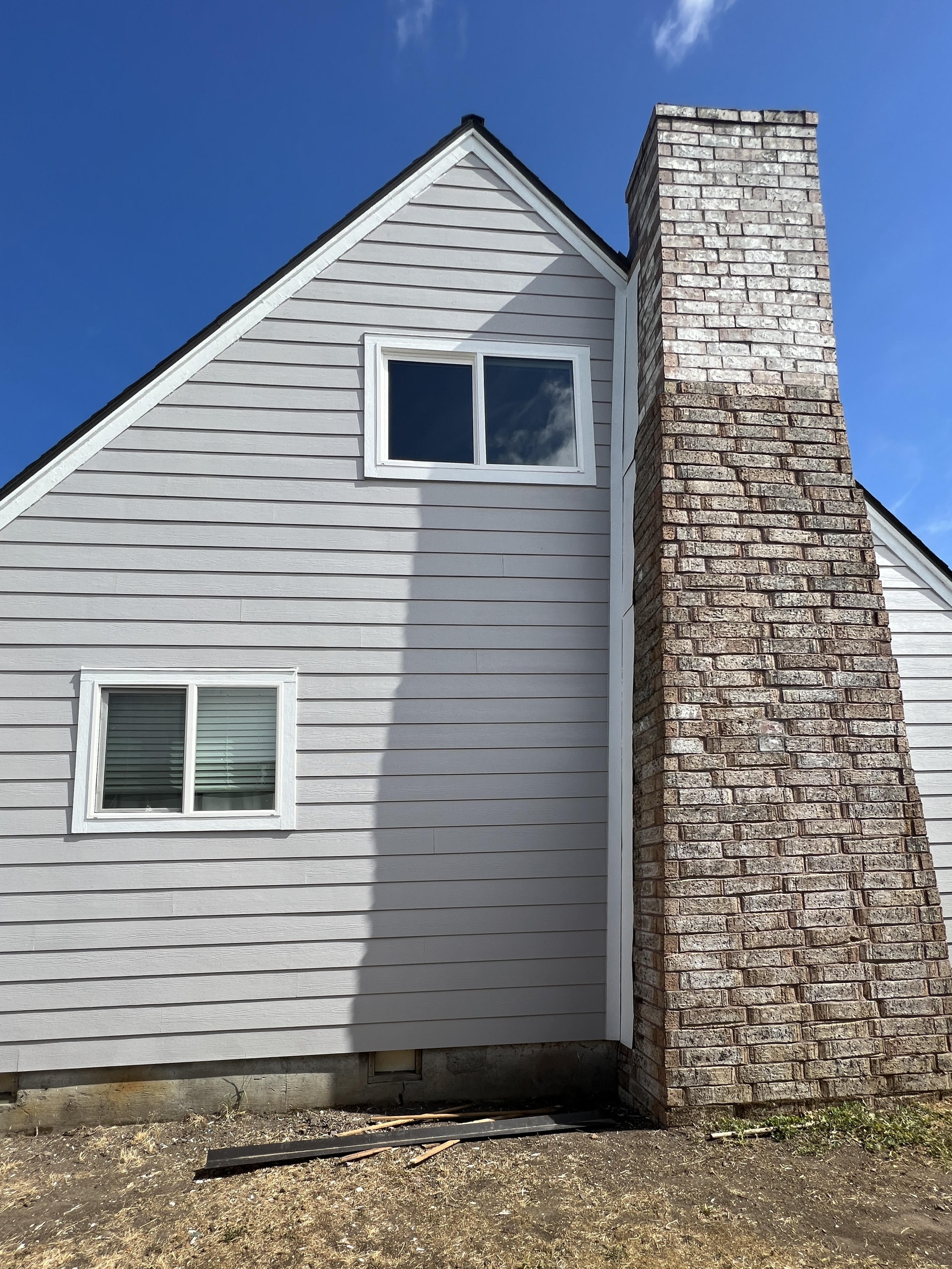 Siding project for a property with chimney after photo