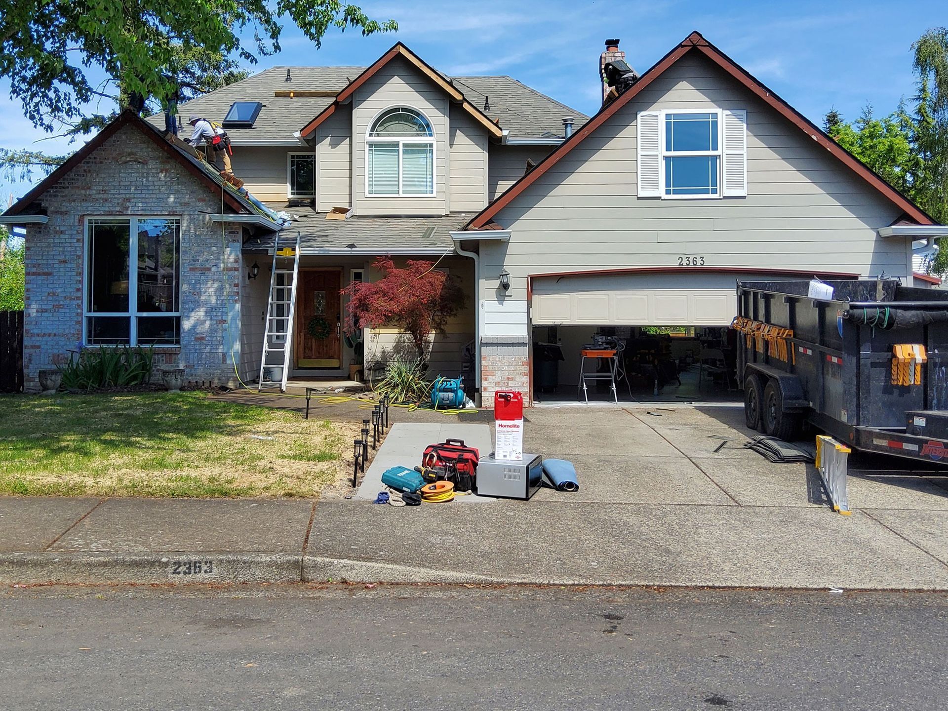 A large house with a truck parked in front of it