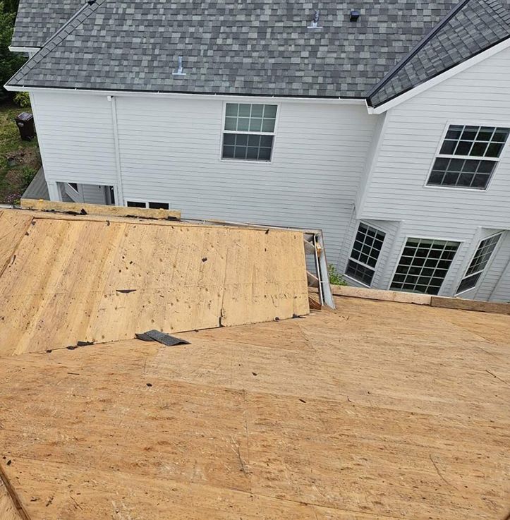 A house with a roof that is being repaired.