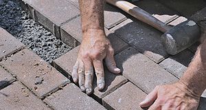 Laying concrete bricks