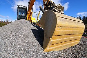 Excavator against blue sky