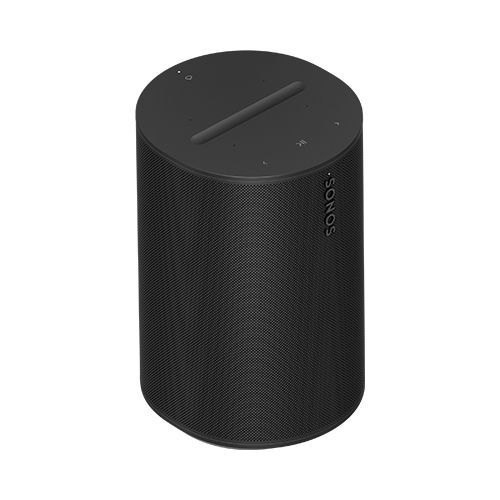 A black sonos speaker is sitting on a white surface.