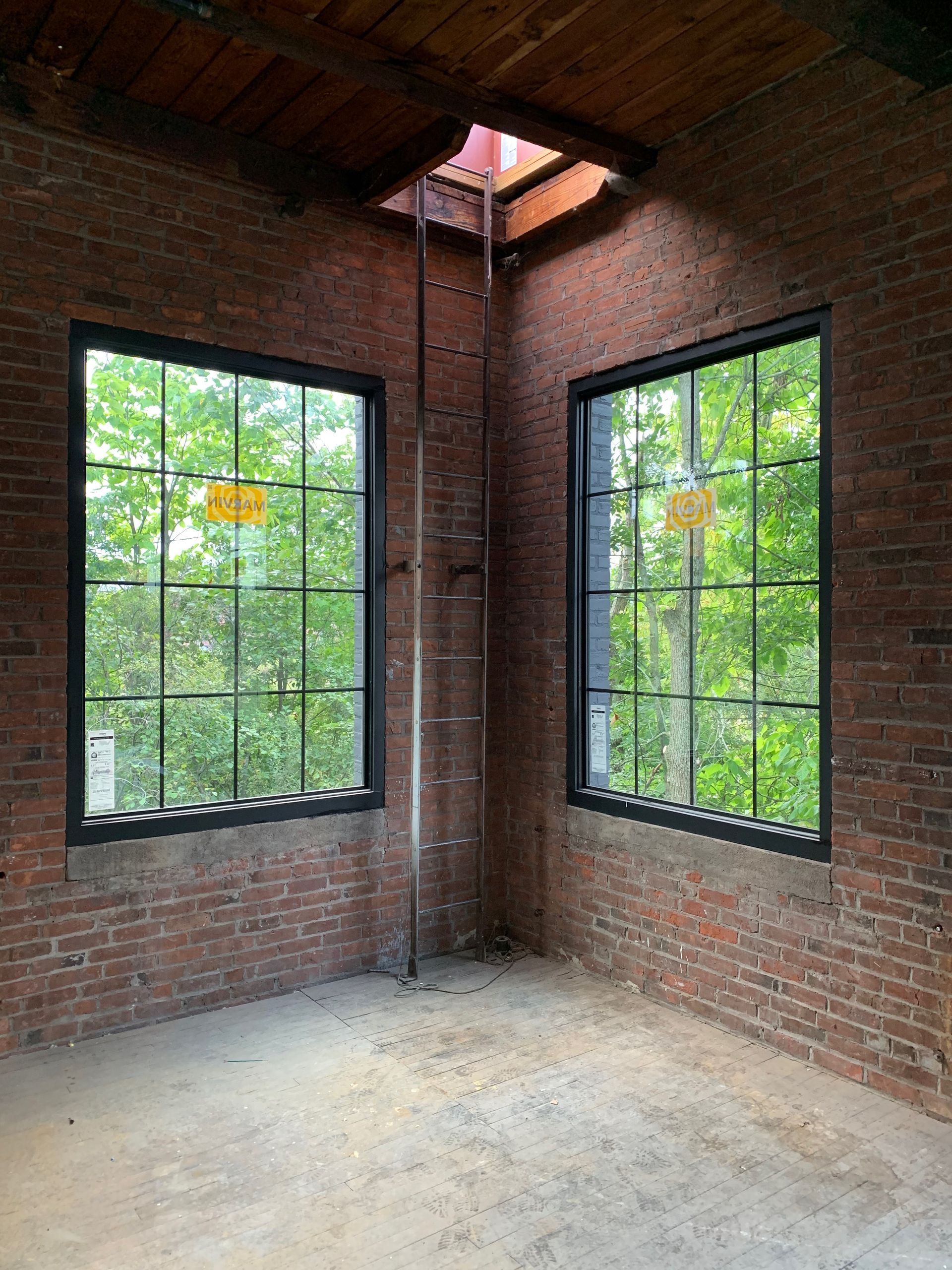 There are two windows in the corner of the room.