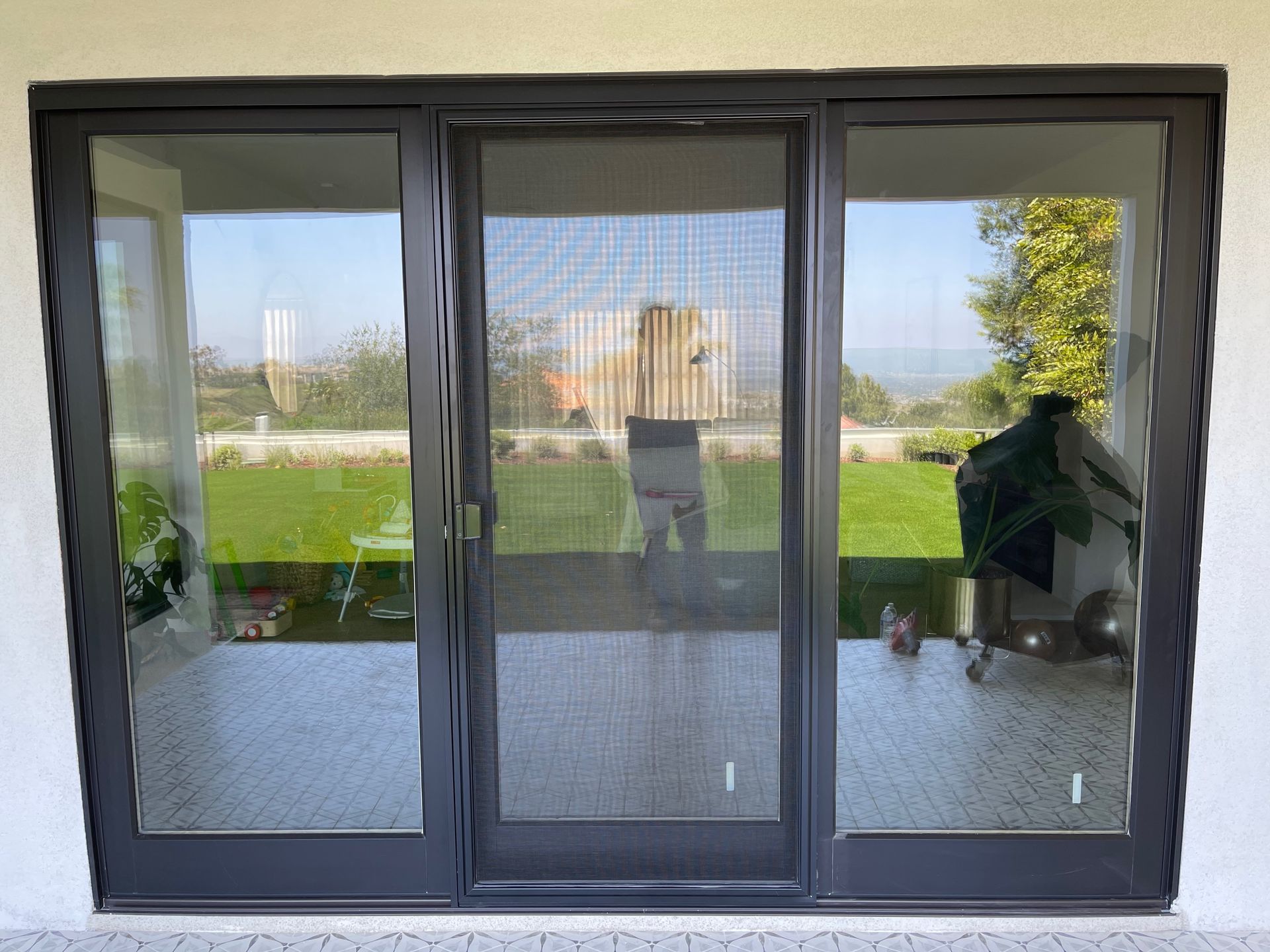 A sliding glass door with a screen on it